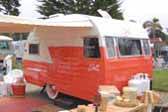 Beautifully restored Vintage Shasta 1400 travel trailer in pastel orange
